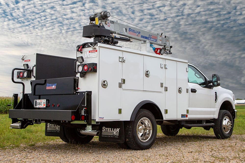 Raskull-upfitted white service truck with a crane-equipped mechanic body